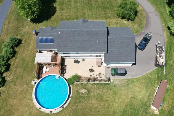 roofing-contractor-connecticut Aerial view of Connecticut home with new roof replacement