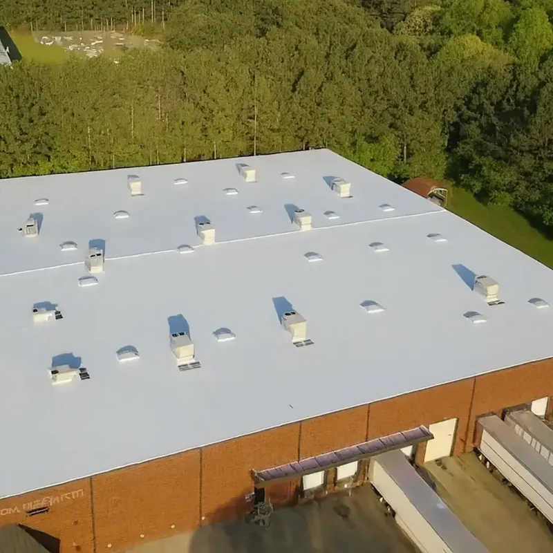 White low-slope roofing system on a Connecticut commercial-style building