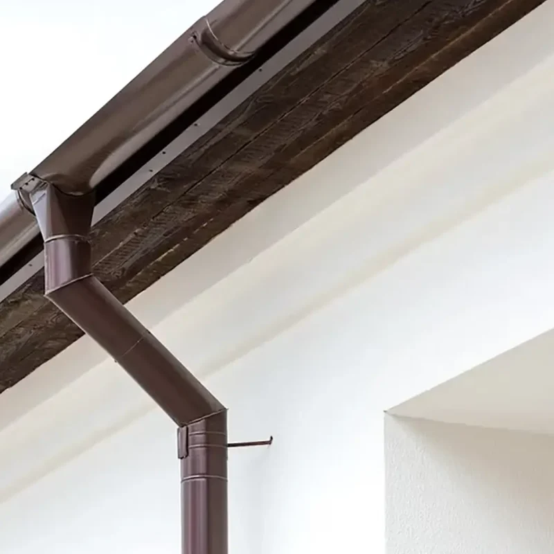 Ellis Builders gutter work showing drainage planning below a Connecticut roof edge