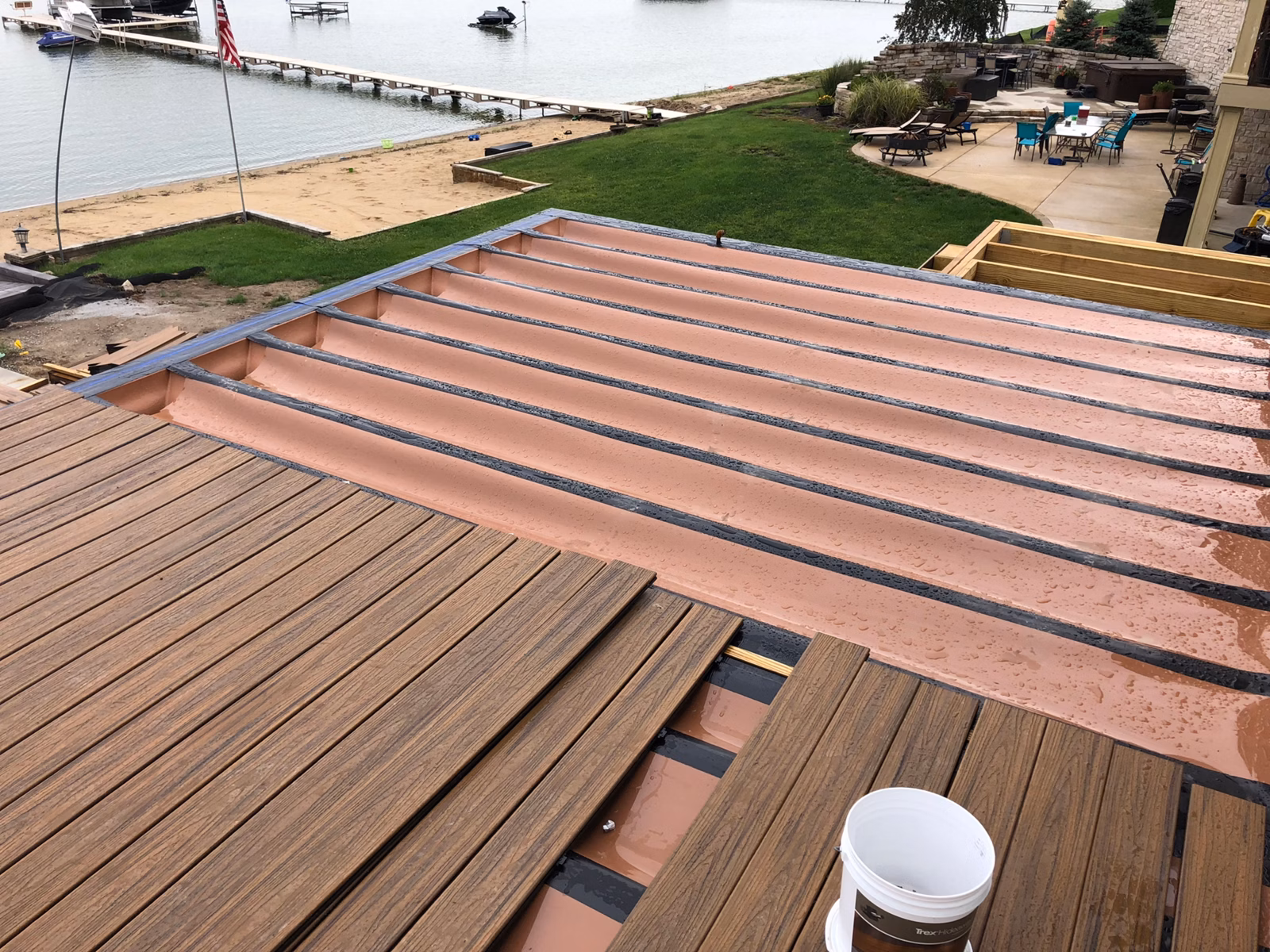Trex RainEscape troughs installed above deck joists before decking